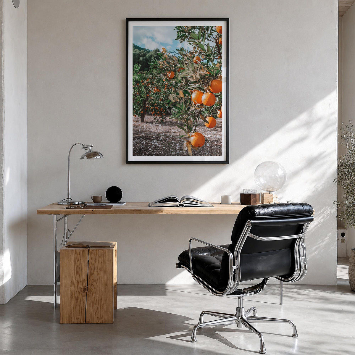 Orange Tree no. 1 colorful photo poster – vertical wall art in black wood frame with white border, hanging on wall