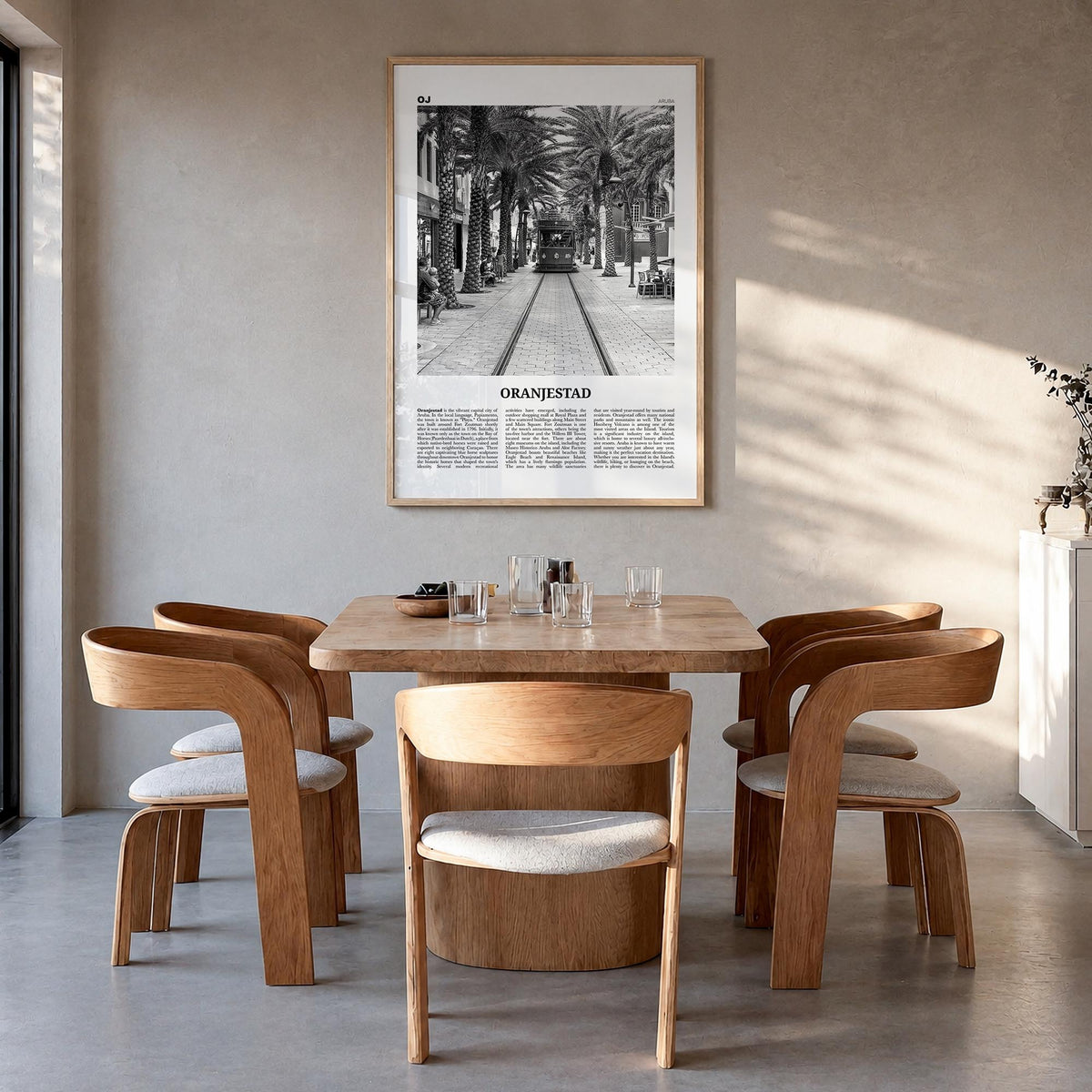 Oranjestad black & white newspaper poster of Aruba – vertical wall art in natural wood frame, hanging on wall