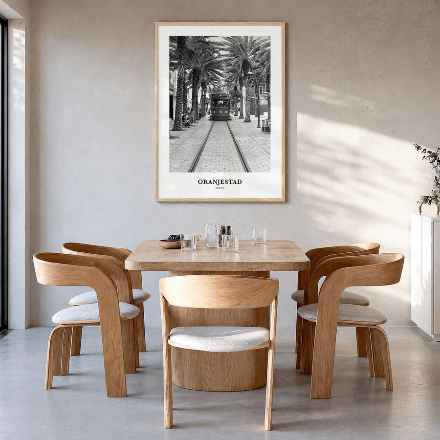 Oranjestad Classic Poster in a natural wood frame, hanging in a dining room