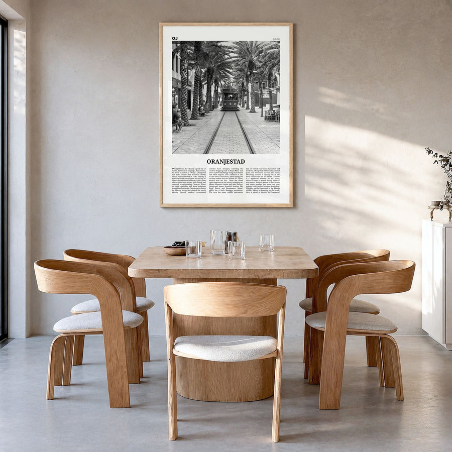 Oranjestad Newspaper Poster in a natural wood frame, hanging in a dining room