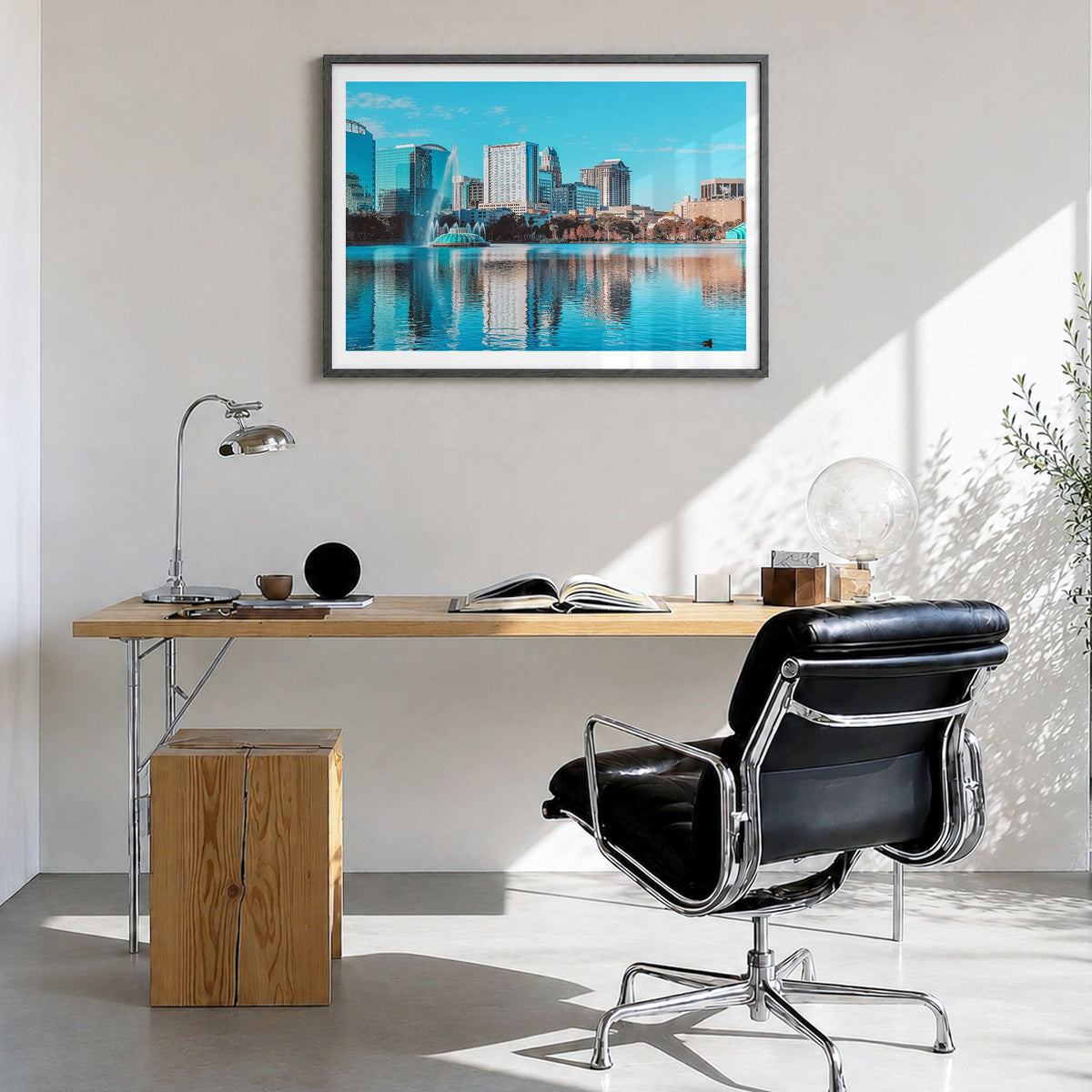 Orlando Photo Poster in a black wood frame, hanging in a bright home office, white border