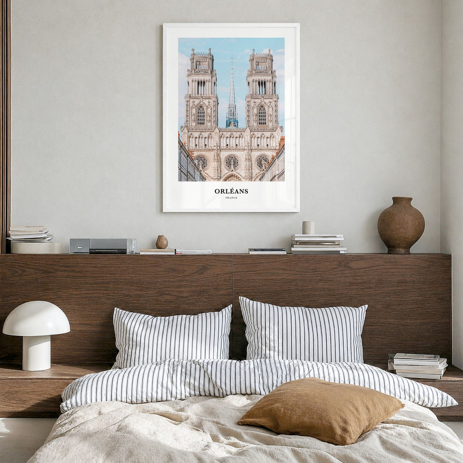 Orléans Classic Poster in a white wood frame, hanging in a bedroom