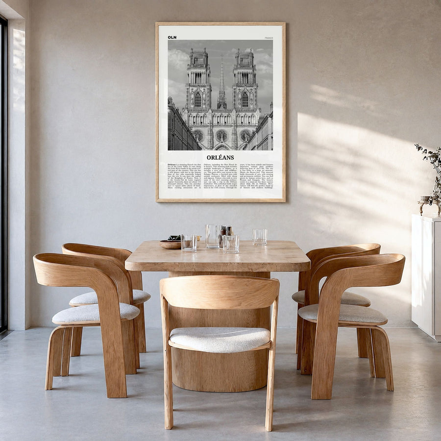 Orléans Newspaper Poster in a natural wood frame, hanging in a dining room