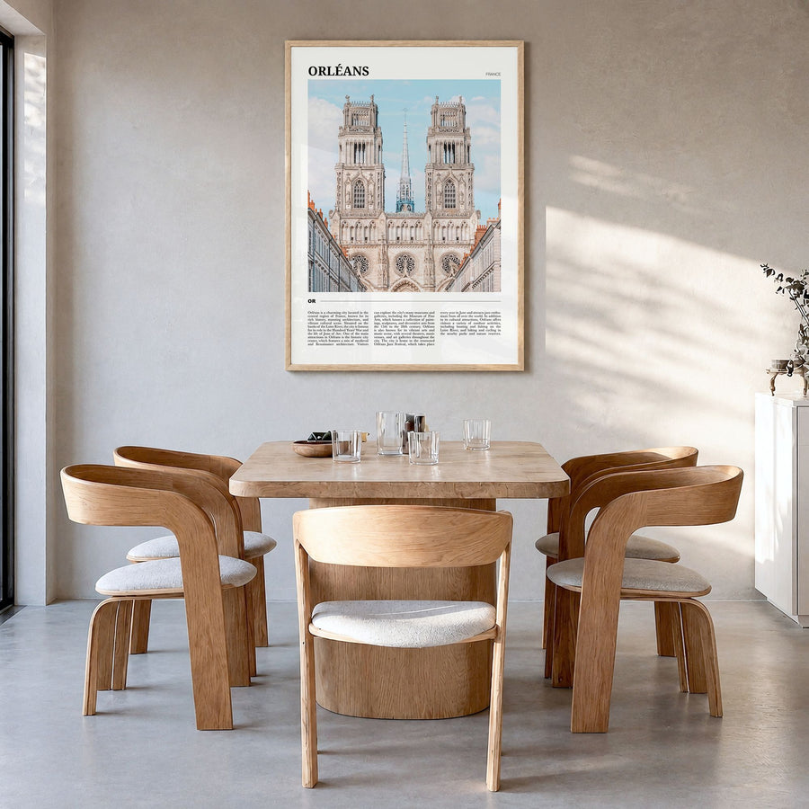 Orléans Travel Poster in a natural wood frame, hanging in a dining room