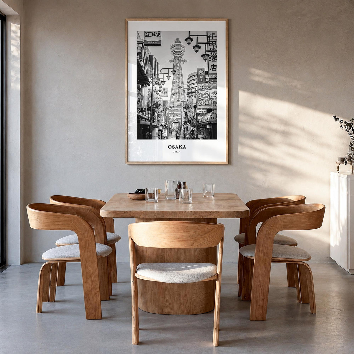 Osaka black & white classic poster of Japan – vertical wall art in natural wood frame, hanging on wall