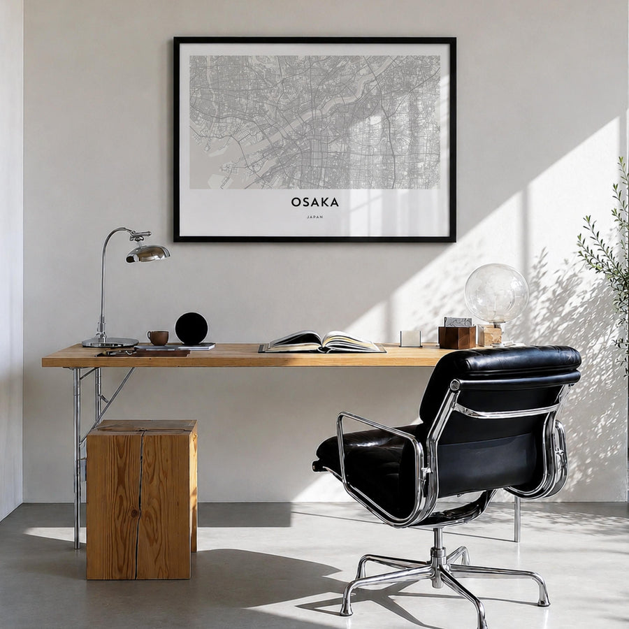 Osaka black & white map poster of Japan – horizontal wall art in black wood frame, hanging on wall