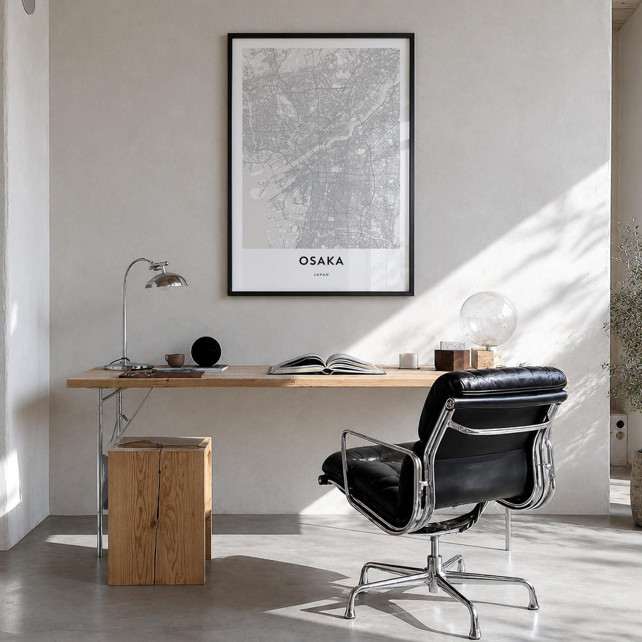 Osaka black & white map poster of Japan – vertical wall art in black wood frame, hanging on wall