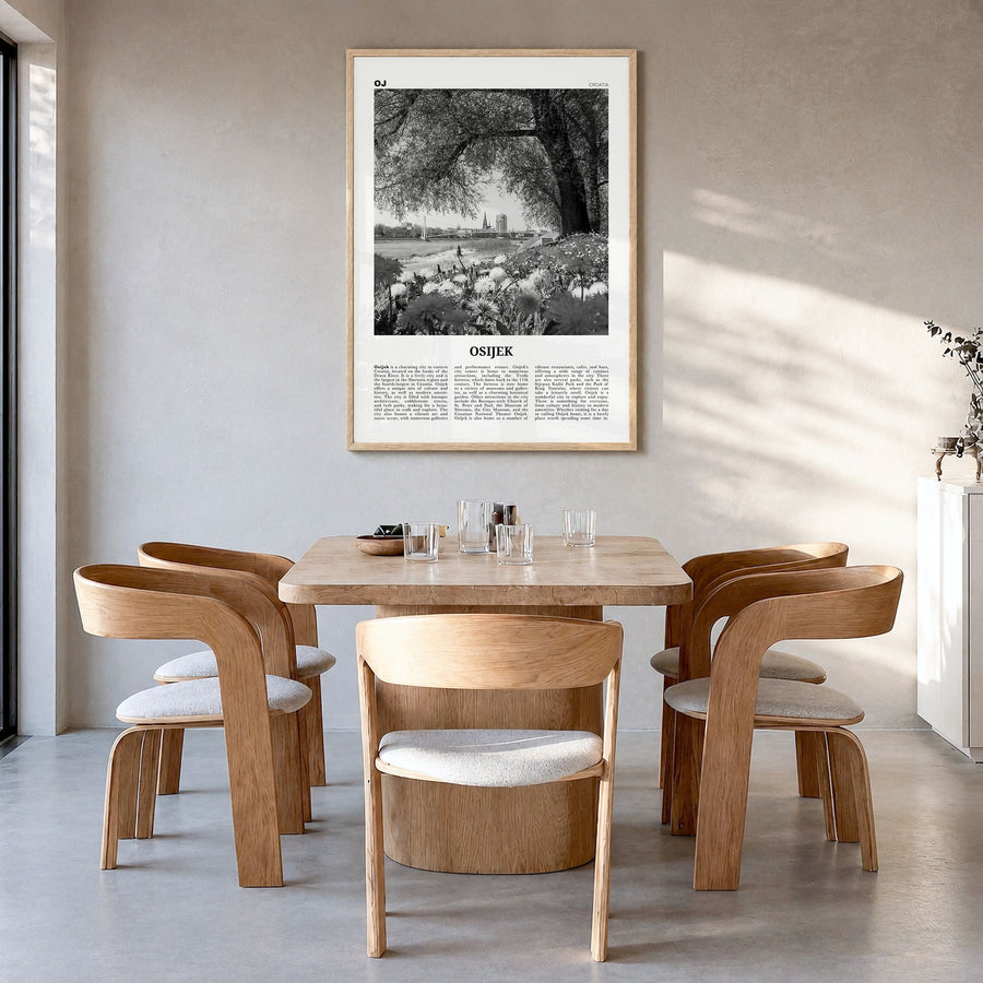 Osijek Newspaper Poster in a natural wood frame, hanging in a dining room