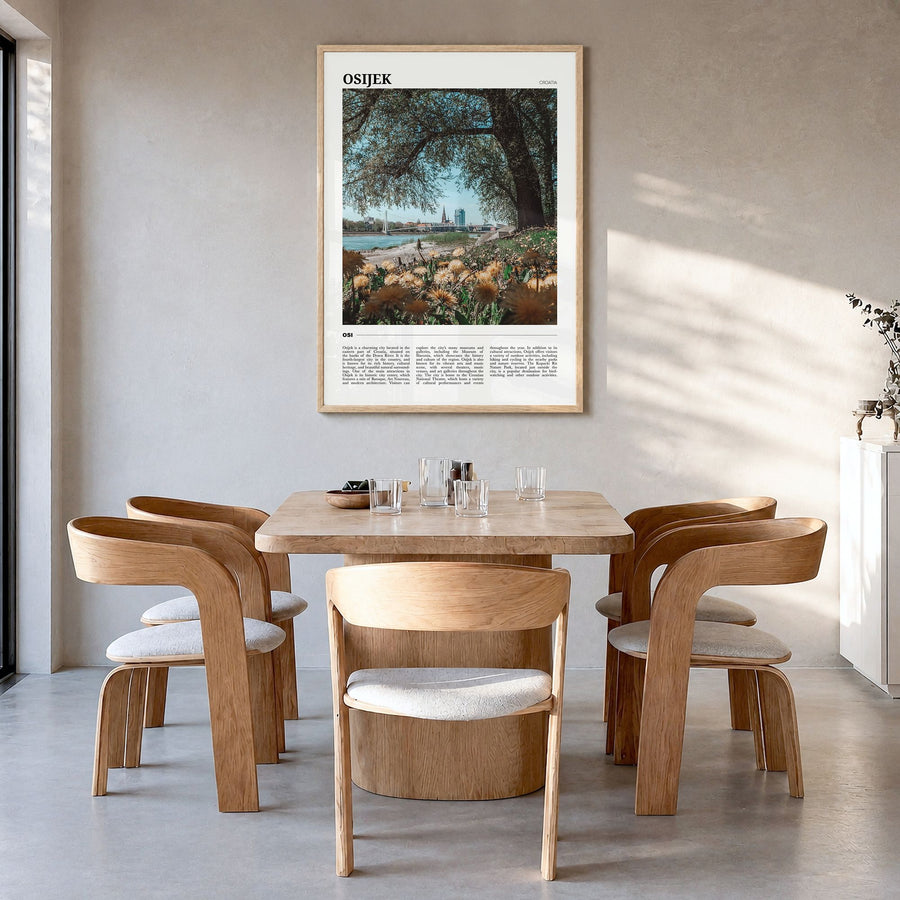Osijek Travel Poster in a natural wood frame, hanging in a dining room