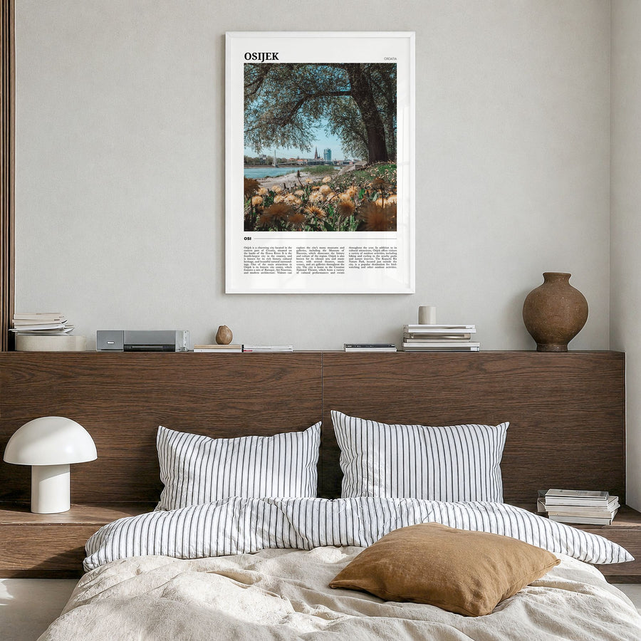 Osijek Travel Poster in a white wood frame, hanging in a bedroom
