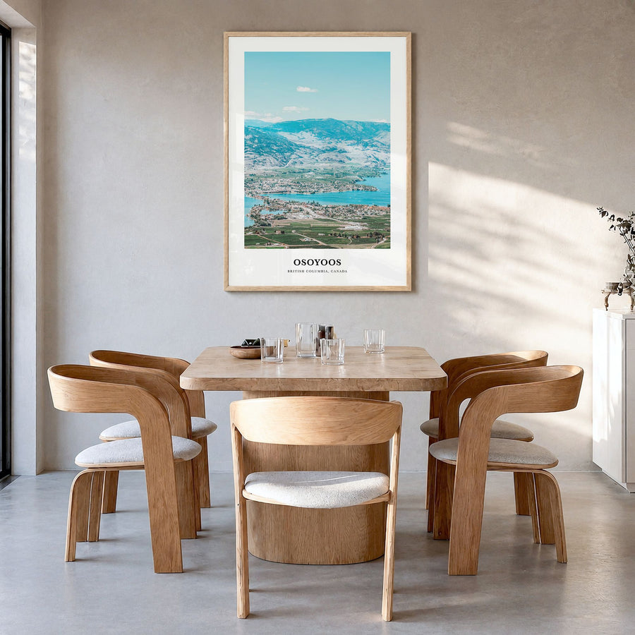 Osoyoos Classic Poster in a natural wood frame, hanging in a dining room