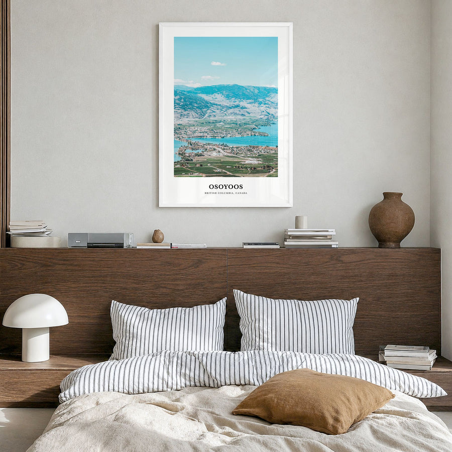 Osoyoos Classic Poster in a white wood frame, hanging in a bedroom
