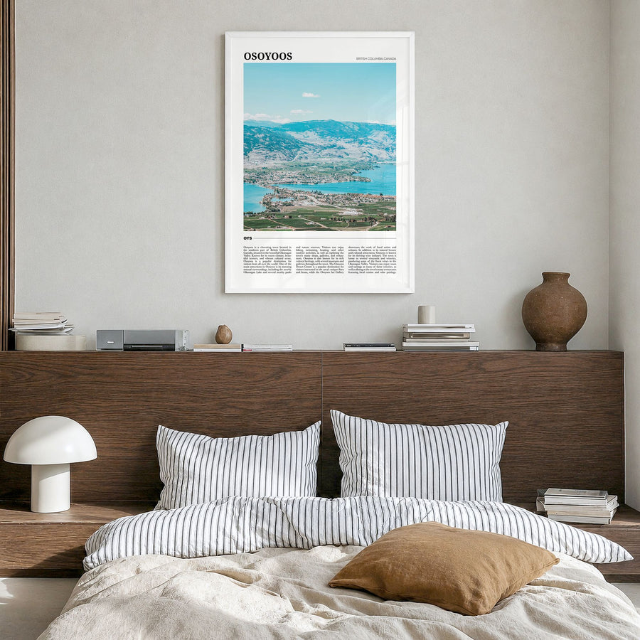 Osoyoos Travel Poster in a white wood frame, hanging in a bedroom