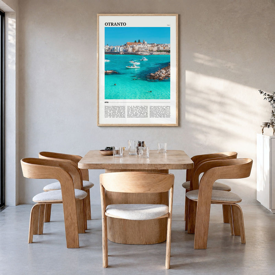 Otranto Travel Poster in a natural wood frame, hanging in a dining room