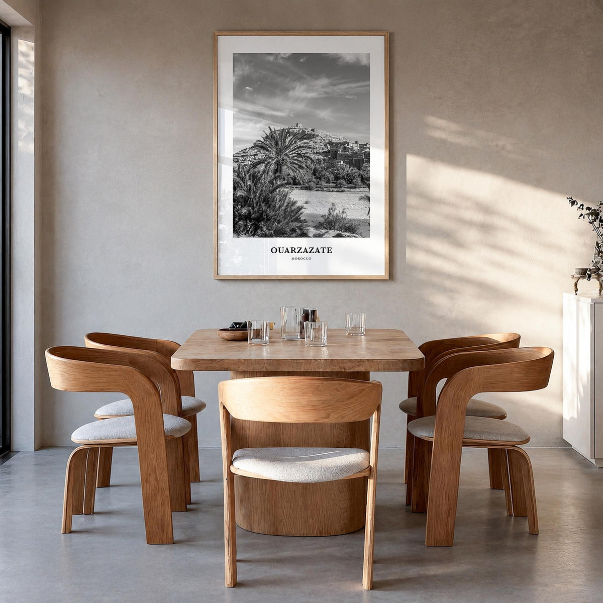 Ouarzazate black & white classic poster of Morocco – vertical wall art in natural wood frame, hanging on wall