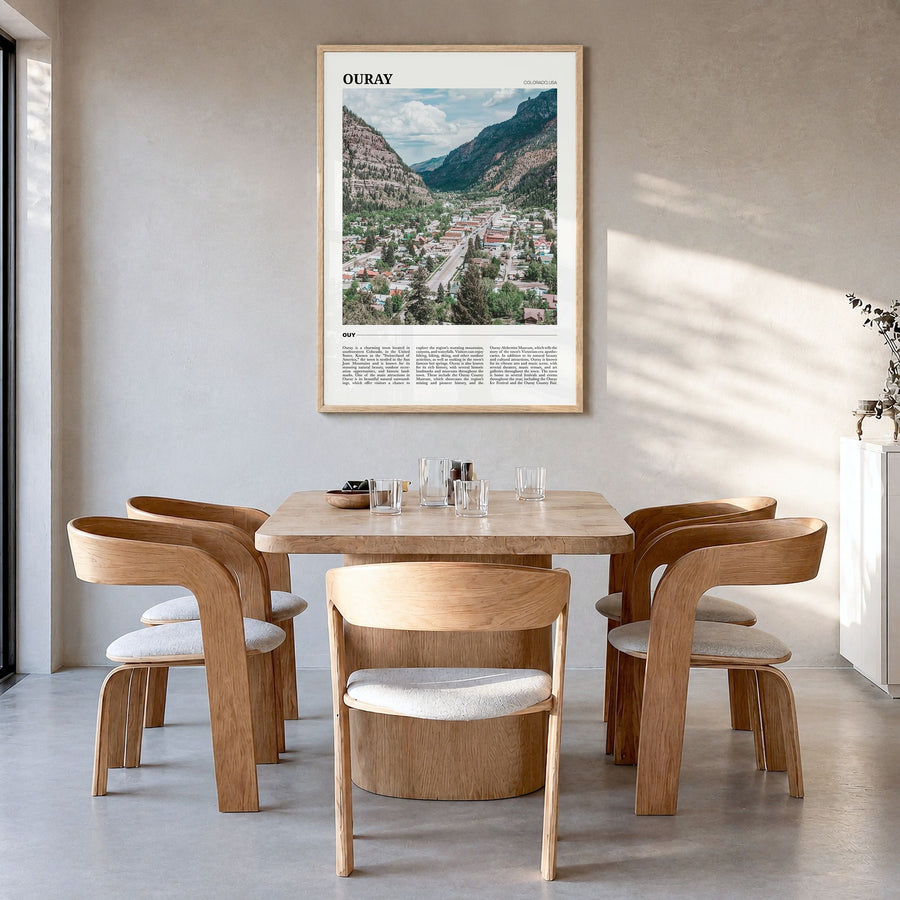 Ouray Travel Poster in a natural wood frame, hanging in a dining room