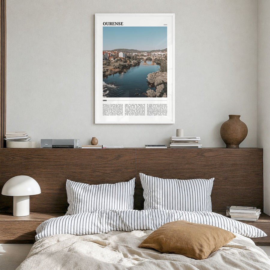 Ourense Travel Poster in a white wood frame, hanging in a bedroom
