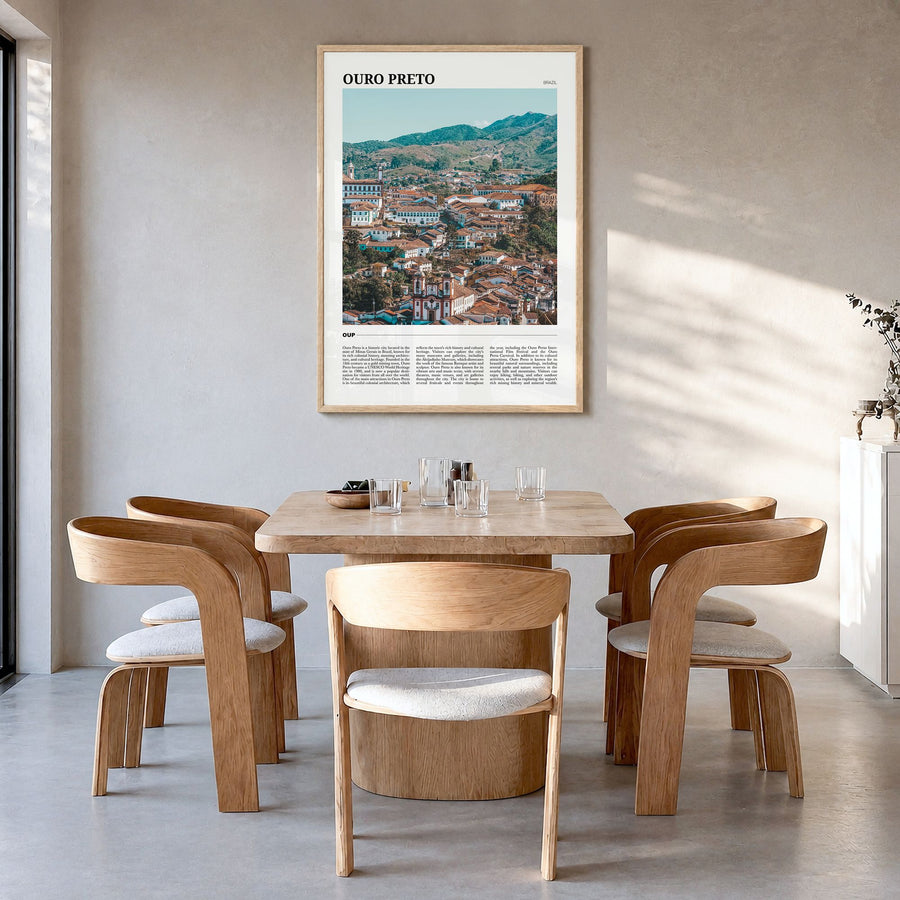 Ouro Preto Travel Poster in a natural wood frame, hanging in a dining room