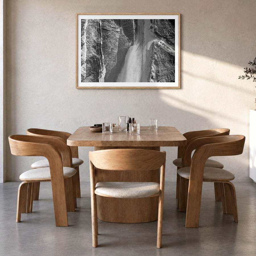 Outer Banks Photo Poster in a natural wood frame, hanging in a dining room, white border