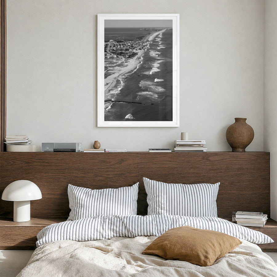 Outer Banks Photo Poster in a white wood frame, hanging in a bedroom, white border