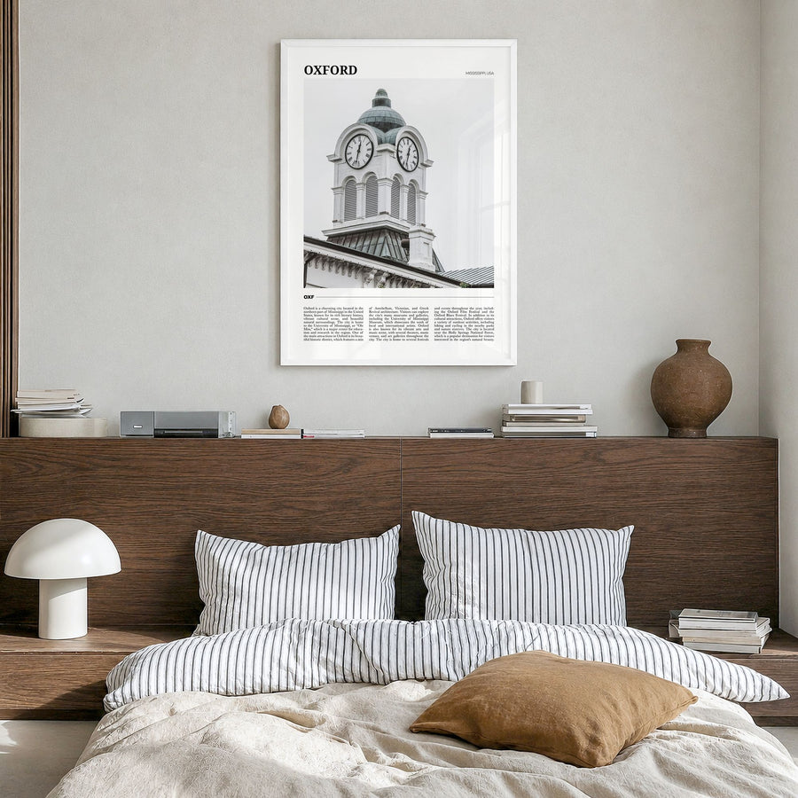 Oxford, Mississippi Travel Poster in a white wood frame, hanging in a bedroom