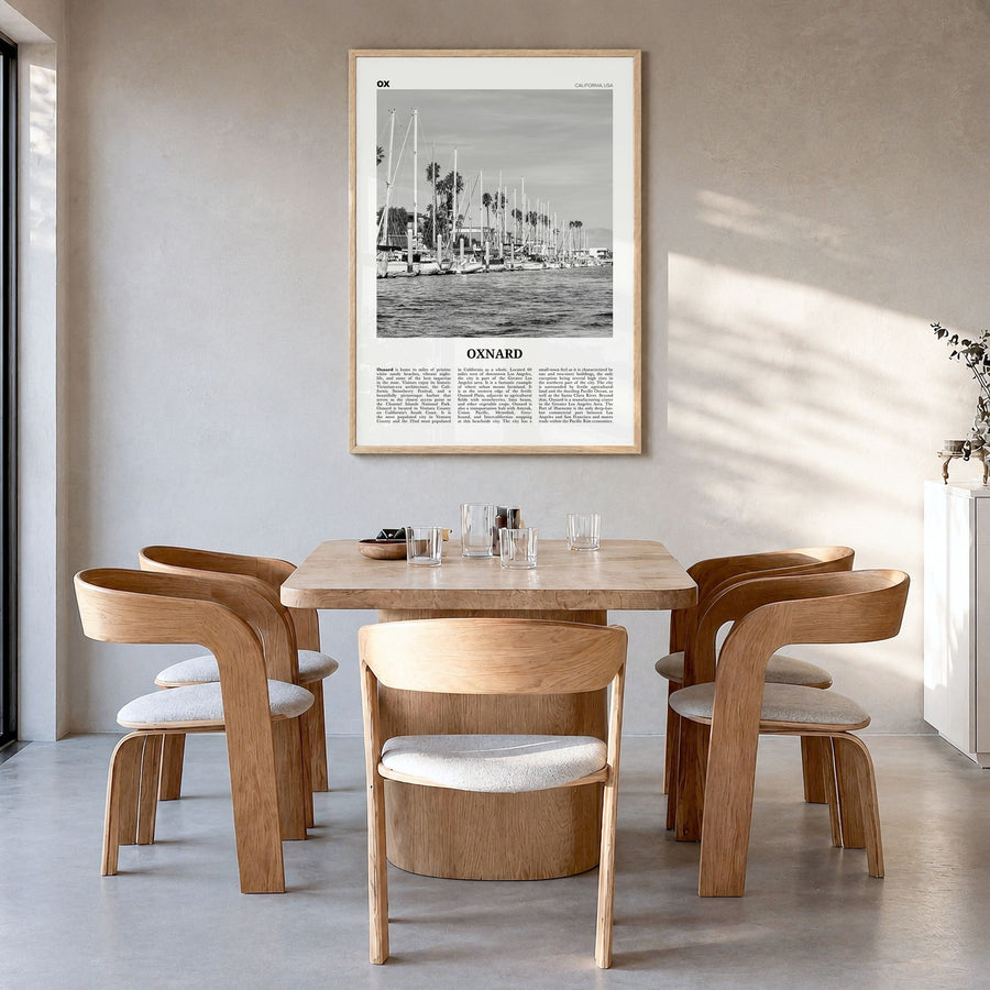 Oxnard Newspaper Poster in a natural wood frame, hanging in a dining room
