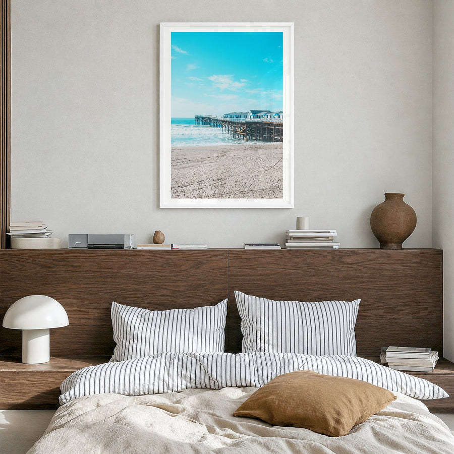 Pacific Beach Photo No 1 Poster in a white wood frame, hanging in a bedroom, white border