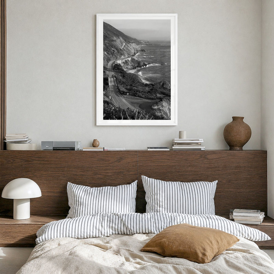 Pacific Coast Highway Photo Poster in a white wood frame, hanging in a bedroom, white border