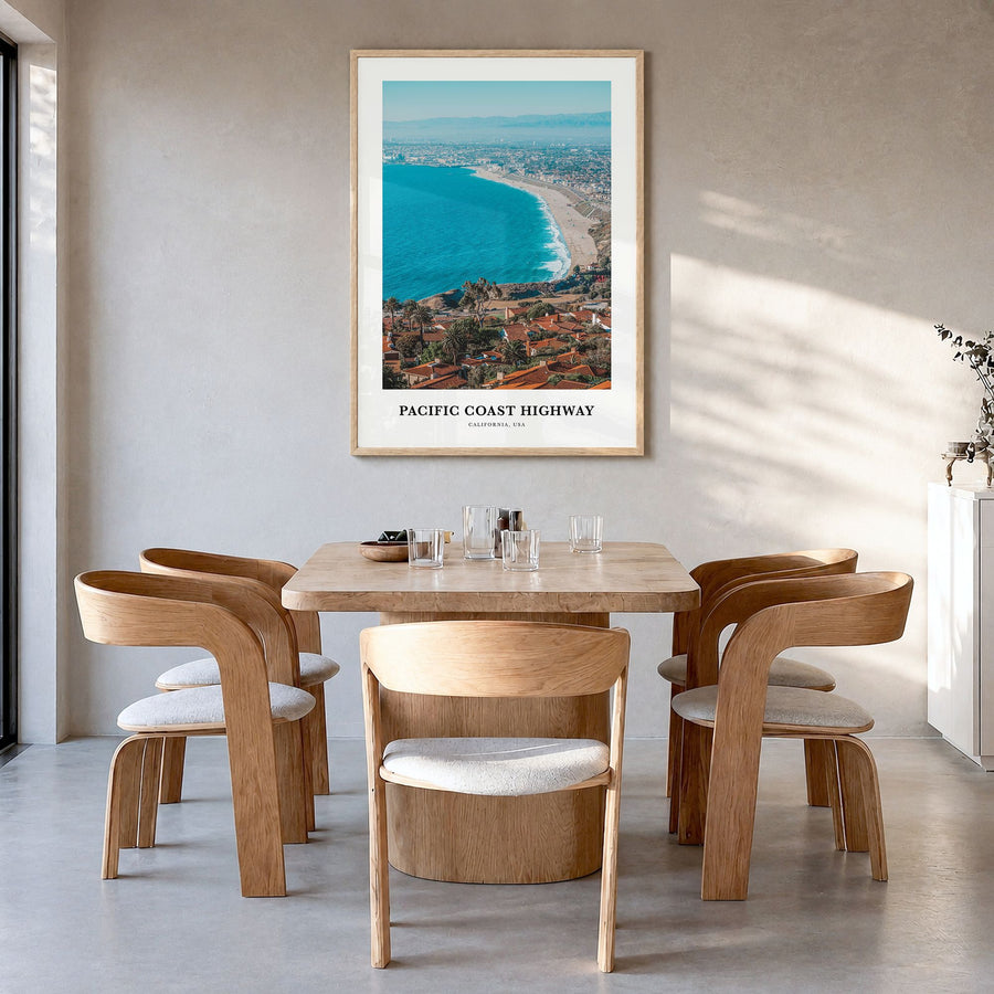 Pacific Coast Highway Classic Poster in a natural wood frame, hanging in a dining room