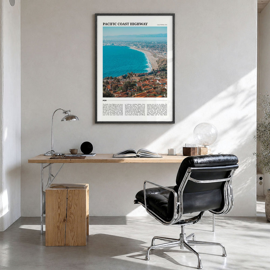 Pacific Coast Highway Travel Poster in a black wood frame, hanging in a bright home office