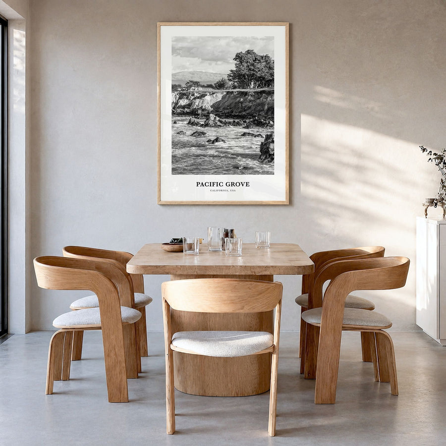 Pacific Grove Classic Poster in a natural wood frame, hanging in a dining room