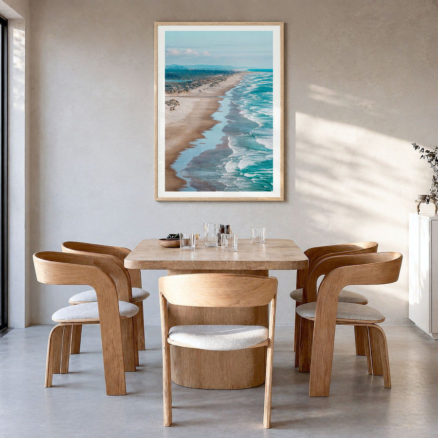 Pacific Northwest Photo Poster in a natural wood frame, hanging in a dining room, white border