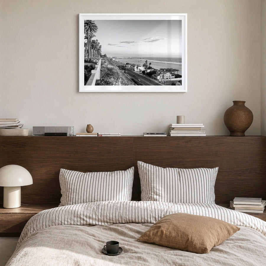Pacific Palisades Photo Poster in a white wood frame, hanging in a bedroom, white border