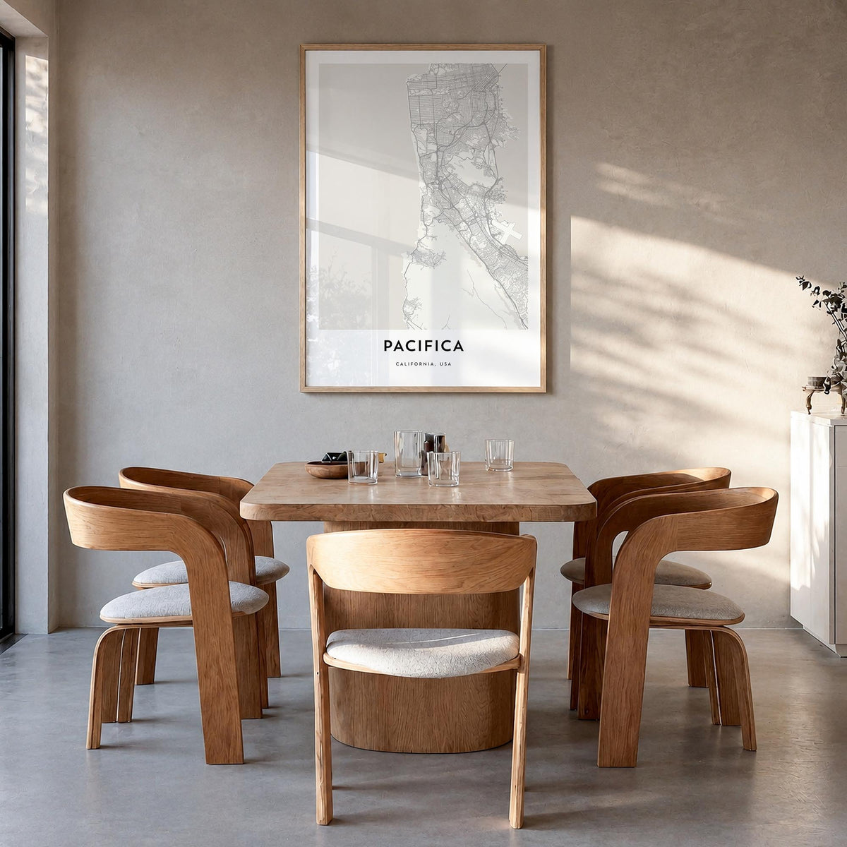 Pacifica black & white map poster of California, USA – vertical wall art in natural wood frame, hanging on wall