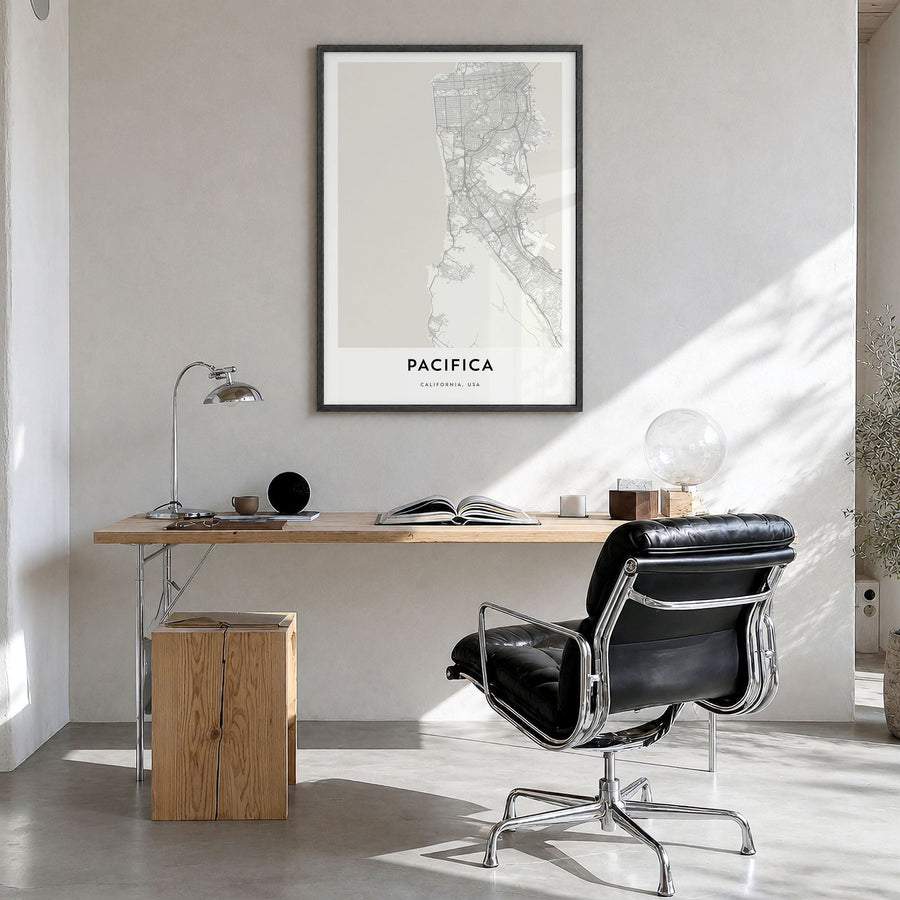 Pacifica Map Poster in a black wood frame, hanging in a bright home office