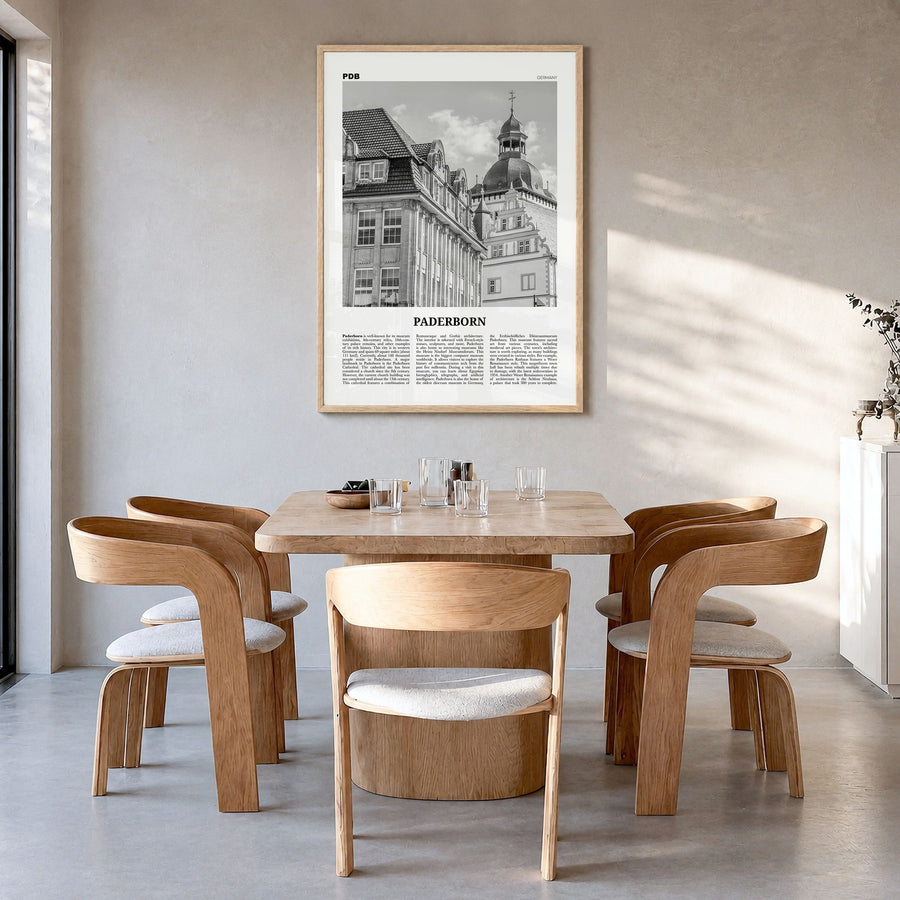 Paderborn Newspaper Poster in a natural wood frame, hanging in a dining room