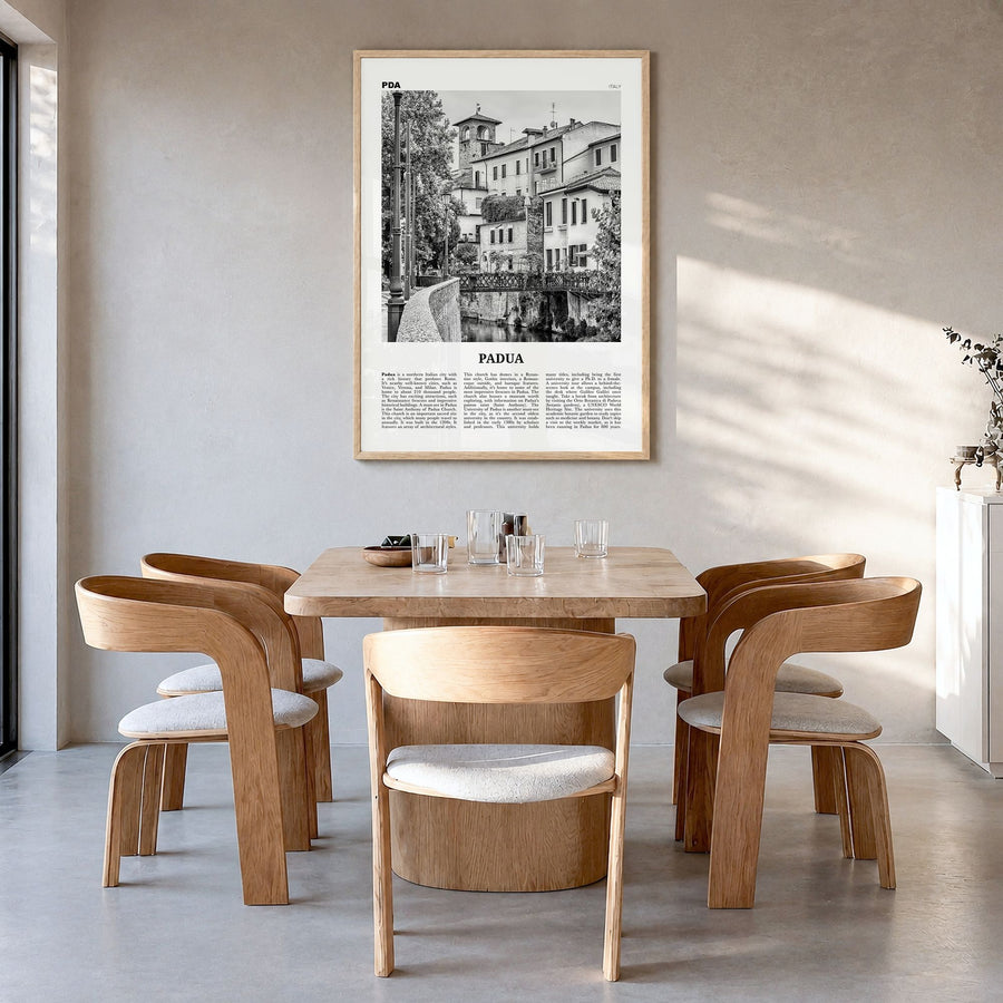 Padua Newspaper Poster in a natural wood frame, hanging in a dining room