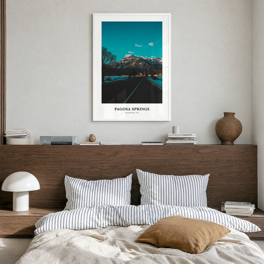Pagosa Springs Classic Poster in a white wood frame, hanging in a bedroom