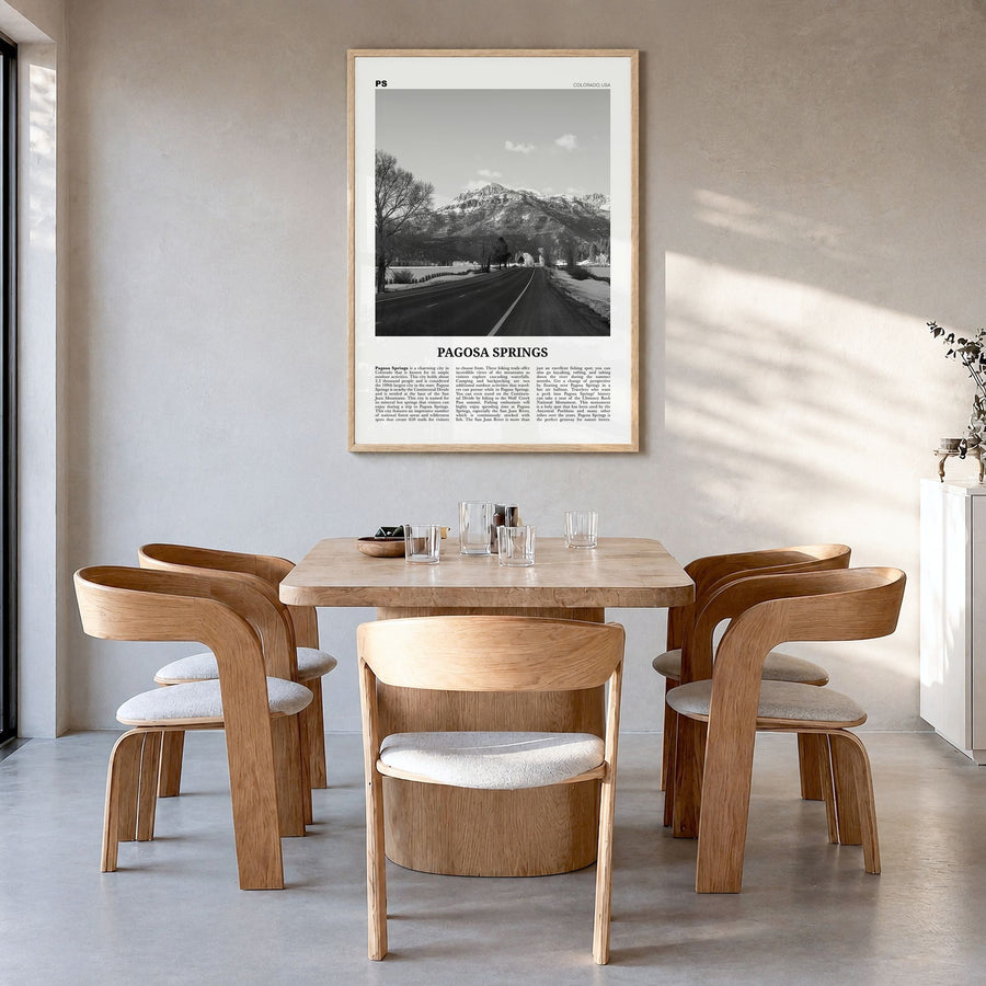 Pagosa Springs Newspaper Poster in a natural wood frame, hanging in a dining room