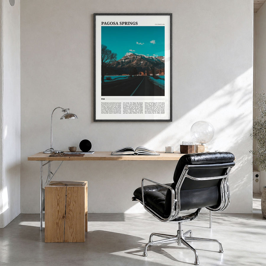 Pagosa Springs Travel Poster in a black wood frame, hanging in a bright home office