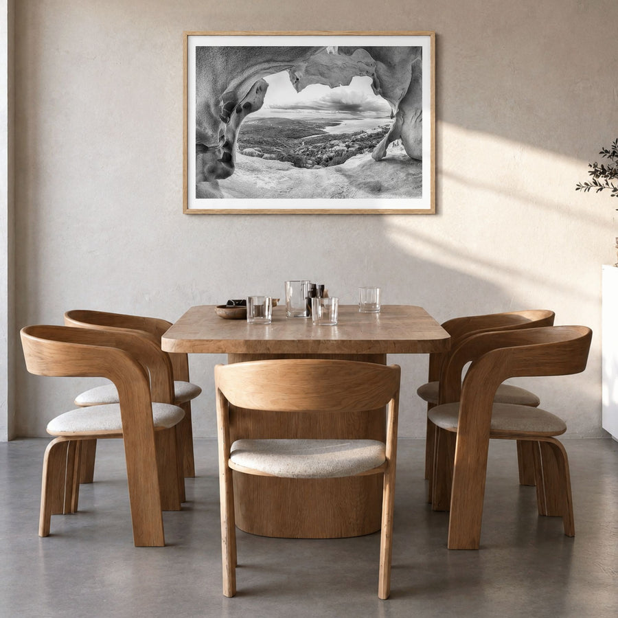 Palau, Italy Photo Poster in a natural wood frame, hanging in a dining room, white border