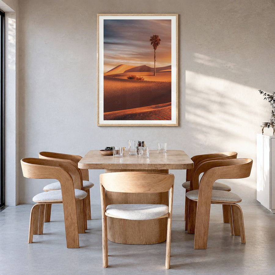 Palm Desert Photo Poster in a natural wood frame, hanging in a dining room, white border