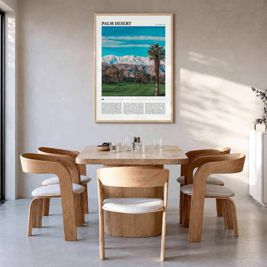 Palm Desert Travel Poster in a natural wood frame, hanging in a dining room