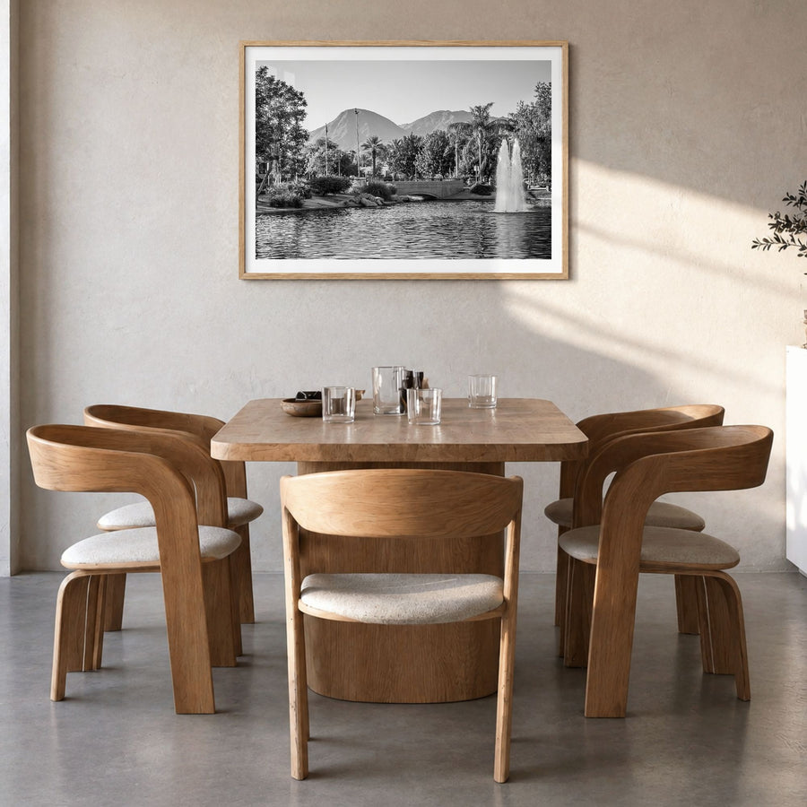 Palm Springs Photo Poster in a natural wood frame, hanging in a dining room, white border