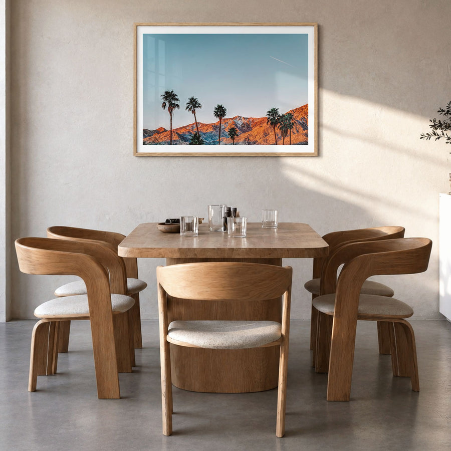 Palm Springs Photo Poster in a natural wood frame, hanging in a dining room, white border