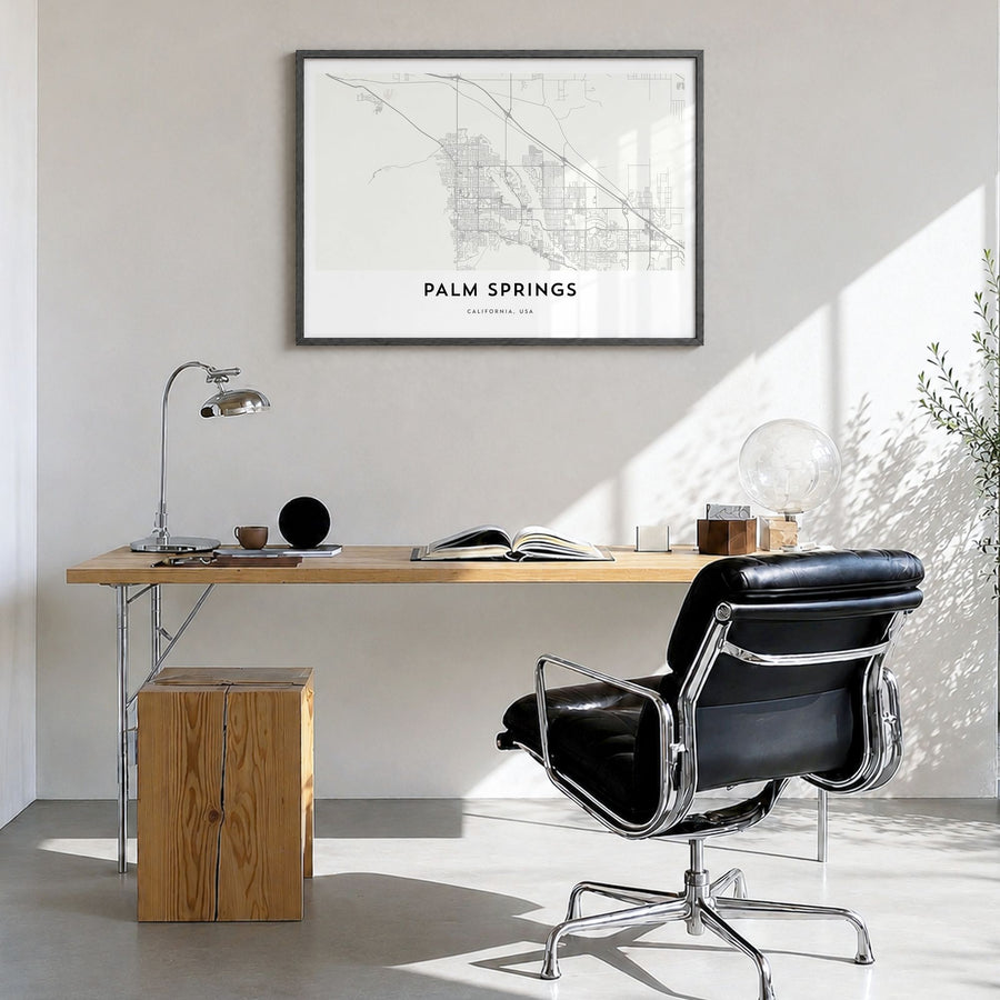 Palm Springs Map Poster in a black wood frame, hanging in a bright home office