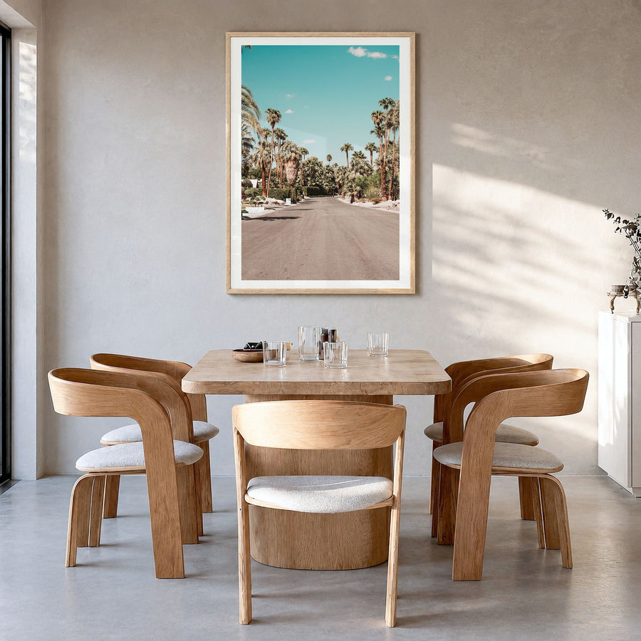 Palm Springs Photo No 1 Poster in a natural wood frame, hanging in a dining room, white border