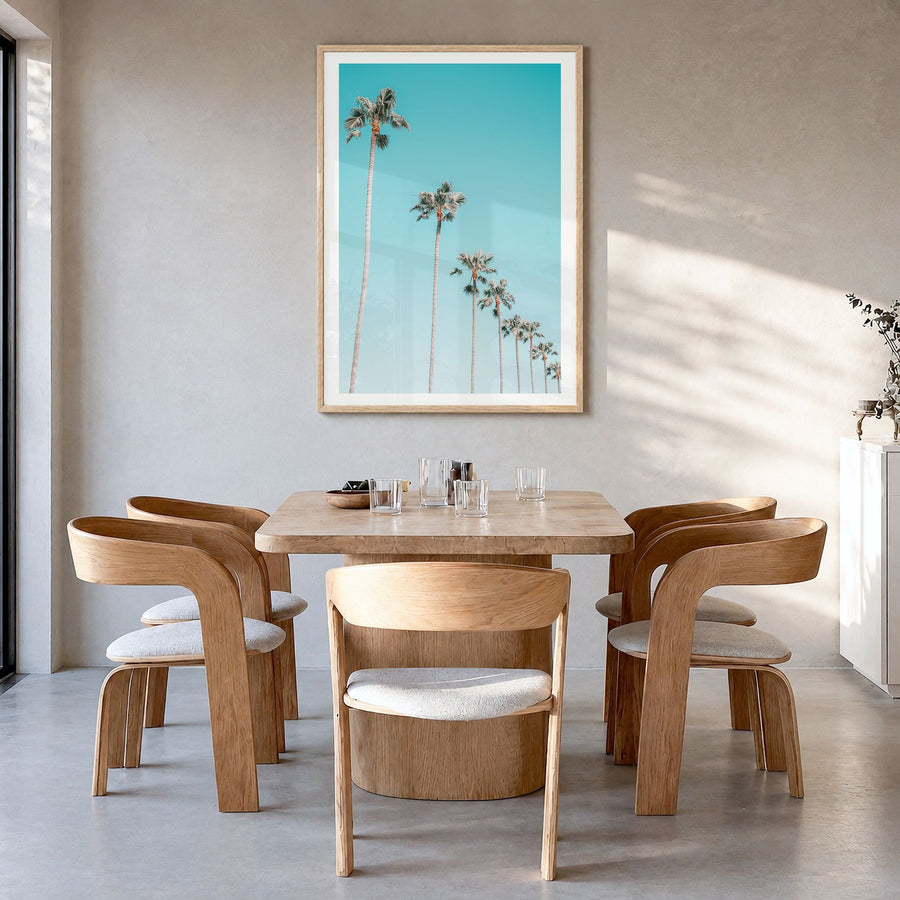 Palm Trees Photo No 3 Poster in a natural wood frame, hanging in a dining room, white border