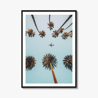 Palm Trees, Sky and Aircraft colorful photo poster – vertical wall art, unframed print shown in interior mockup