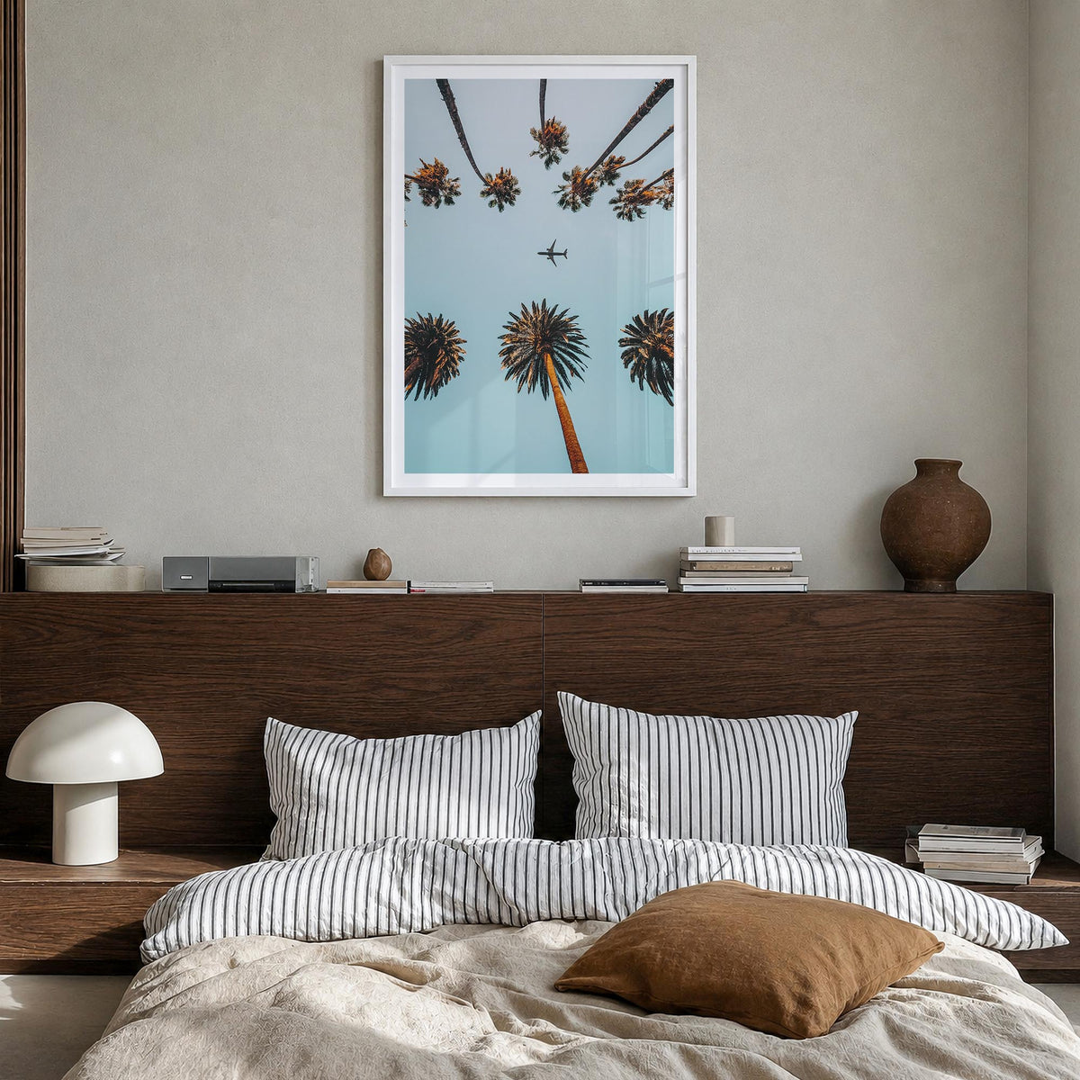 Palm Trees, Sky and Aircraft colorful photo poster – vertical wall art in white wood frame with white border, hanging on wall